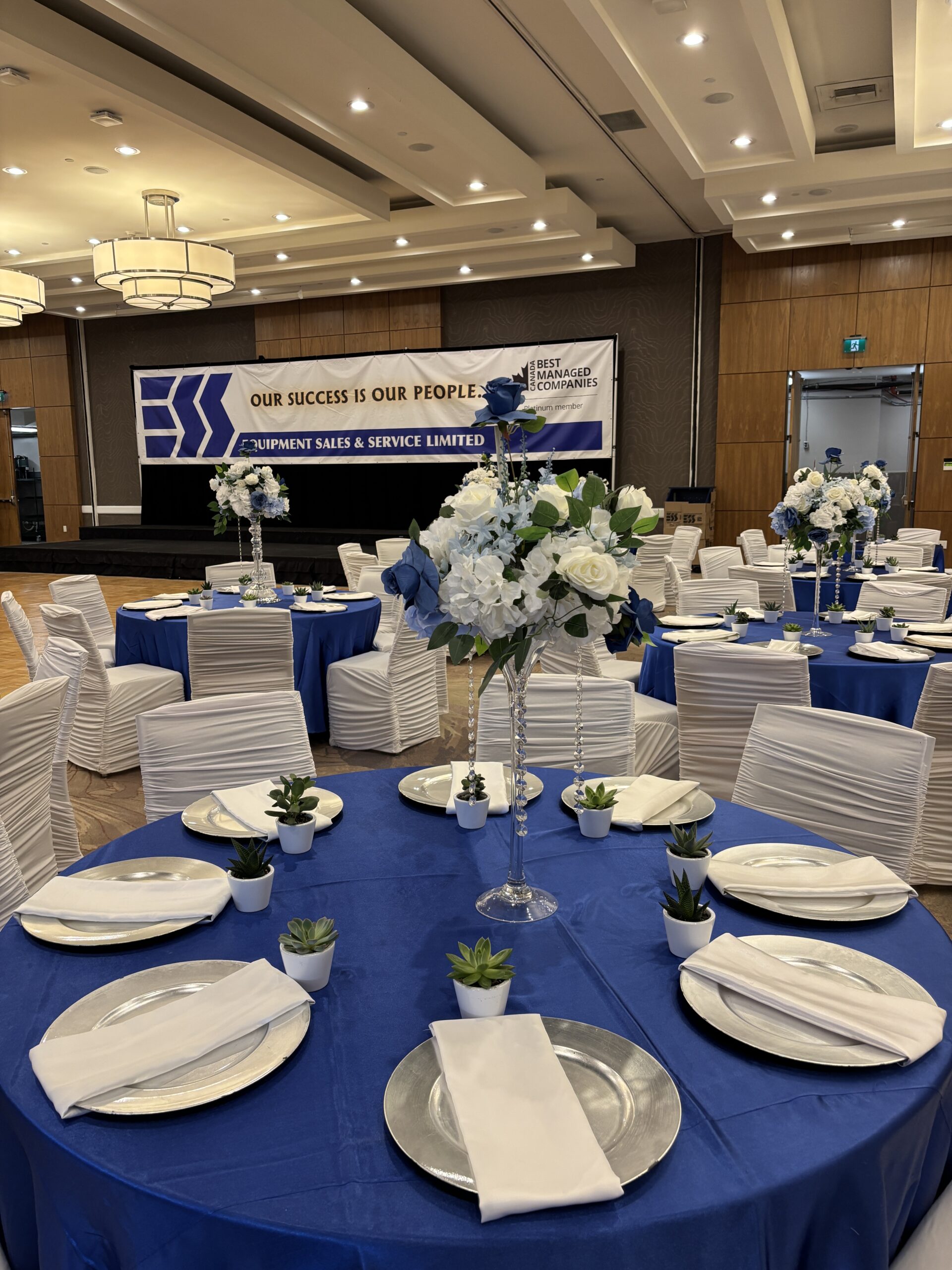 Blue and white corporate event décor and backdrop setup